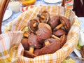 Mushrooms chocolate candy holiday snacks cookies festive food in basket on table picnic feast outdoors