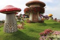 mushrooms and a deer in flowers garden, dubai