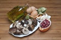 Mushrooms, eggs, ham and olive oil to cook. Royalty Free Stock Photo