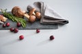 Mushrooms lingonberries and rosmarinus on table