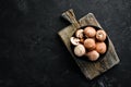 Mushrooms in a plate. Champignons on the old background. Top view. Royalty Free Stock Photo