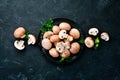 Mushrooms in a plate. Champignons on the old background. Top view. Royalty Free Stock Photo