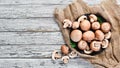 Mushrooms in a plate. Champignons on the old background. Top view. Royalty Free Stock Photo