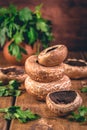 Mushrooms Porto Bello on kitchen table with fresh herbs Royalty Free Stock Photo