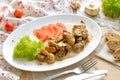 Mushrooms with sauce on the white plate Royalty Free Stock Photo