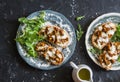 Mushrooms tartine. Baked sandwiches with mushrooms chanterelles and mozzarella on a dark background