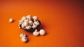 Mushrooms in a wooden bowl on an orange background. The small white champignon in a plate and scattered near it Royalty Free Stock Photo