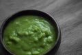 Mushy peas in a wooden bowl Royalty Free Stock Photo