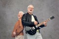 Happy senior couple with electric guitar singing Royalty Free Stock Photo