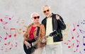 Senior couple in sunglasses with electric guitar Royalty Free Stock Photo