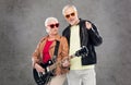 Senior couple in sunglasses with electric guitar Royalty Free Stock Photo