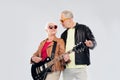 Senior couple in sunglasses with electric guitar Royalty Free Stock Photo