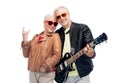 Senior couple with guitar showing rock hand sign Royalty Free Stock Photo