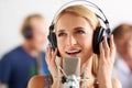 Music, art and woman with microphone, headphones and band performance with talent. Recording studio, singing and happy Royalty Free Stock Photo