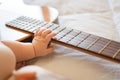 Baby arm on guitar Royalty Free Stock Photo