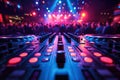 music board console DJ mixer with turntable in night club in booth at party against background of people dancing under Royalty Free Stock Photo