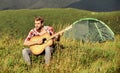 Music brings harmony to the world. western camping and hiking. hipster fashion. happy and free. cowboy man with acoustic