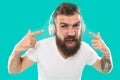 Music chart. Hipster with beard listening music. Handsome music lover. Man in headphones. Streaming sites which we Royalty Free Stock Photo