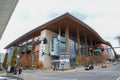 Music City Center surrounded by gorgeous yellow and green autumn trees, people walking along the sidewalk and cars driving Royalty Free Stock Photo