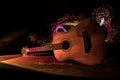 Music concept. Acoustic guitar isolated on a dark background under beam of light with smoke with copy space. Guitar Strings, close Royalty Free Stock Photo