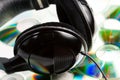 Music concept - headphones and audio cds Royalty Free Stock Photo