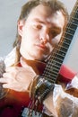 Music Concepts.Closeup Portrait of Young Male Guitar Player Posi Royalty Free Stock Photo