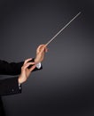 Music conductor with a baton