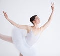 Music, dance and ballet with a woman in studio on a white background for rehearsal or recital for theatre performance