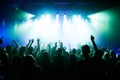 Music, dance and party with crowd at concert for rock, live band performance and festival show. New year, celebration Royalty Free Stock Photo