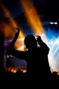 Music fan enjoying night perfomance of famous artist on stage Royalty Free Stock Photo