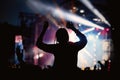 Music fan enjoying night perfomance of famous artist on stage Royalty Free Stock Photo