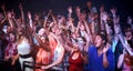 Music, fans and people dance at concert, event and lights from stage for performance at festival. Nightclub, party and