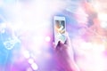 Music fans takes a photo guitarist on stage in concert on smart phone, Soft focus and pastel color tone