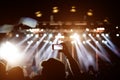 Music fans takes picture of stage in concert on smartphone. Royalty Free Stock Photo