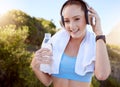 Music, fitness and water with a sports woman listening to audio on headphones in a workout, exercise or training outside Royalty Free Stock Photo