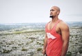 Music is a great motivator. Cropped shot of a muscular young man exercising outdoors.