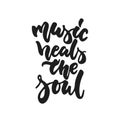 Music heals the soul - hand drawn lettering quote isolated on the white background. Fun brush ink vector illustration