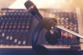 Music instruments or dj concept. The microphone, headphones and sound mixer Royalty Free Stock Photo