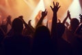 Music, lights and hands of crowd at concert for party, disco and live band performance. Dance, nightclub and silhouette Royalty Free Stock Photo