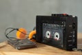 Music listening concept. Vintage cassette tape, audio player and headphones Royalty Free Stock Photo