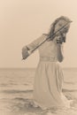 Woman playing violin on violin near beach Royalty Free Stock Photo