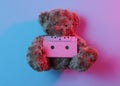 Music lover concept Teddy bear hold audio cassette Royalty Free Stock Photo