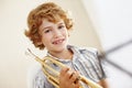 Music makes me happy. a cute little boy playing the trumpet. Royalty Free Stock Photo