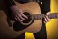 the composer plays brute force on an acoustic guitar Royalty Free Stock Photo