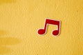 Music note plastic sticker on cement wall Royalty Free Stock Photo
