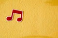 Music note plastic sticker on colorful cement wall Royalty Free Stock Photo