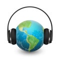 Music planet earth with headphones, vector realistic illustration Royalty Free Stock Photo