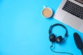 Music or podcast background with headphones, microphone, coffee and laptop on blue table, flat lay. Top view, flat lay Royalty Free Stock Photo