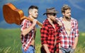 Music is poetry. men with guitar in checkered shirt. western camping. campfire songs. happy men friends with guitar