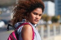 Music, portrait and black woman in a city for travel, trip or summer break with cool afro. Podcast, student and girl Royalty Free Stock Photo